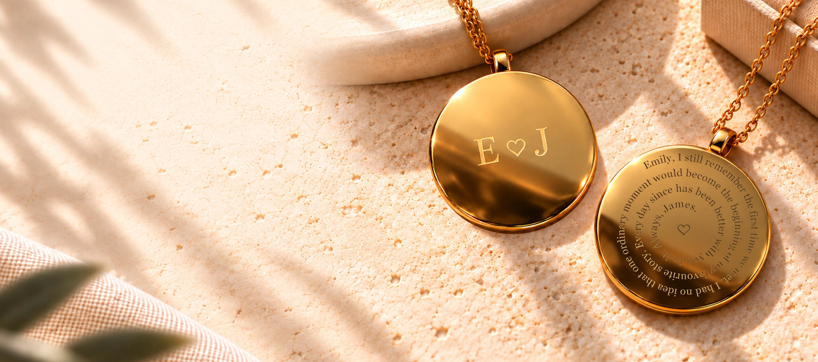 Both sides of a gold pendant: E heart J initials on the front and a personal story engraved in a spiral on the back